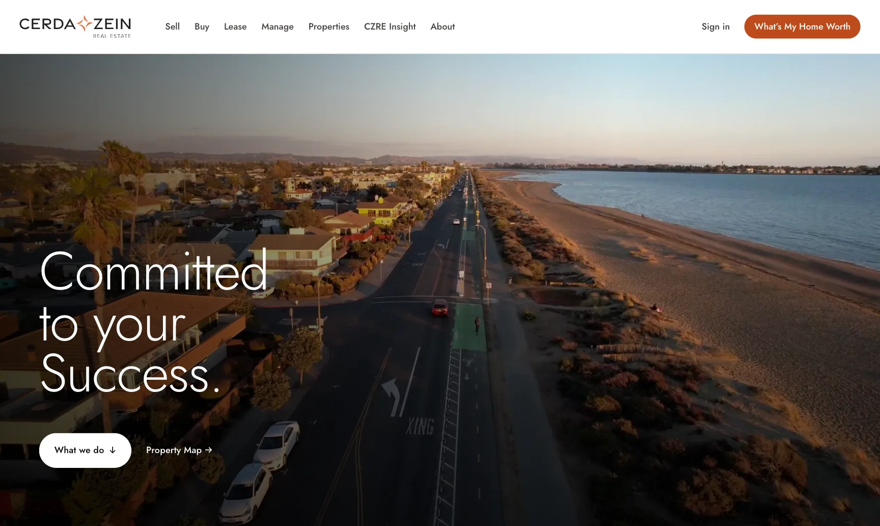 Cerda-Zein Real Estate website on MacBook